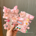 Nuevo diseño para niños lindo arco 24pcs clips para el cabello